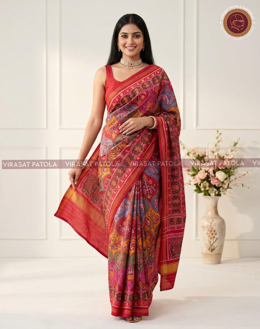 Multicolour traditional patola saree, red-and-blue field with geometric bands and gold hem