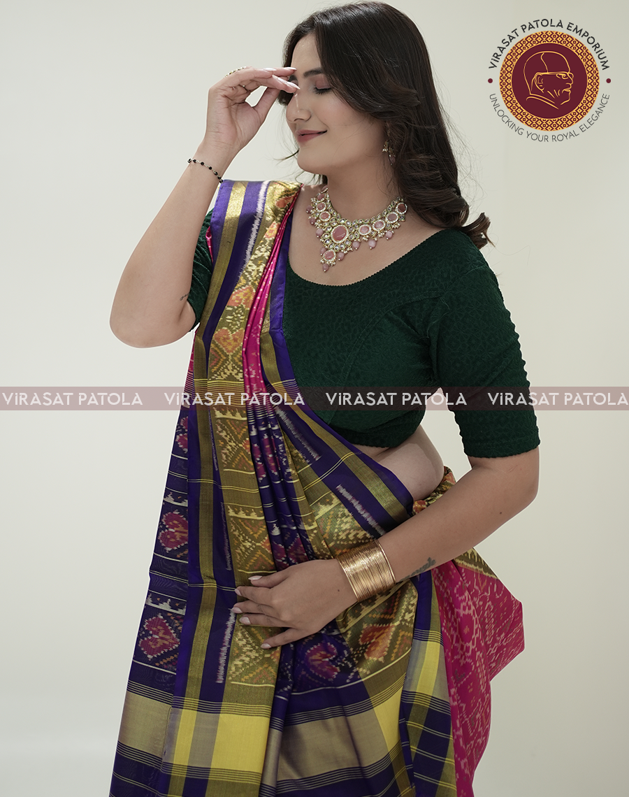 Pink Patola saree pallu with blue-purple stripes and gold zari detailing