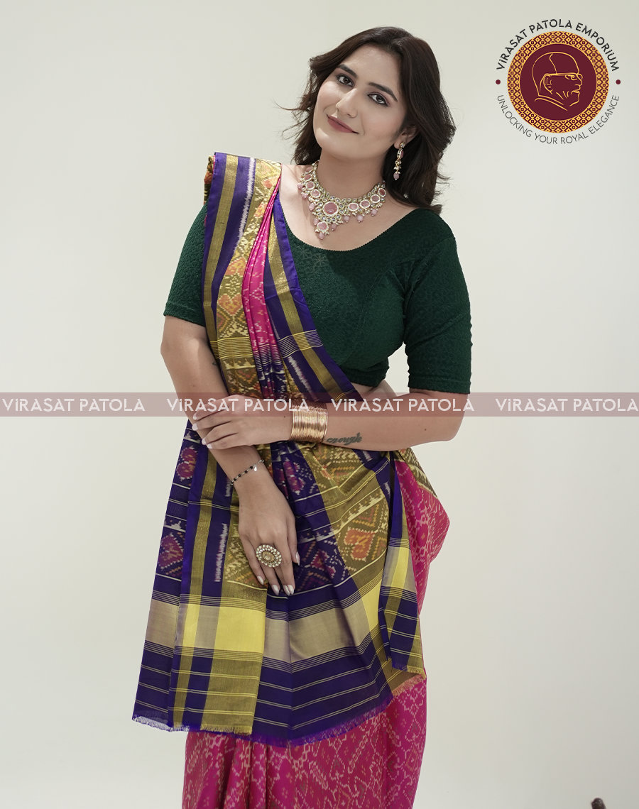 Pink Manekchowk Patola saree with purple and gold striped pallu