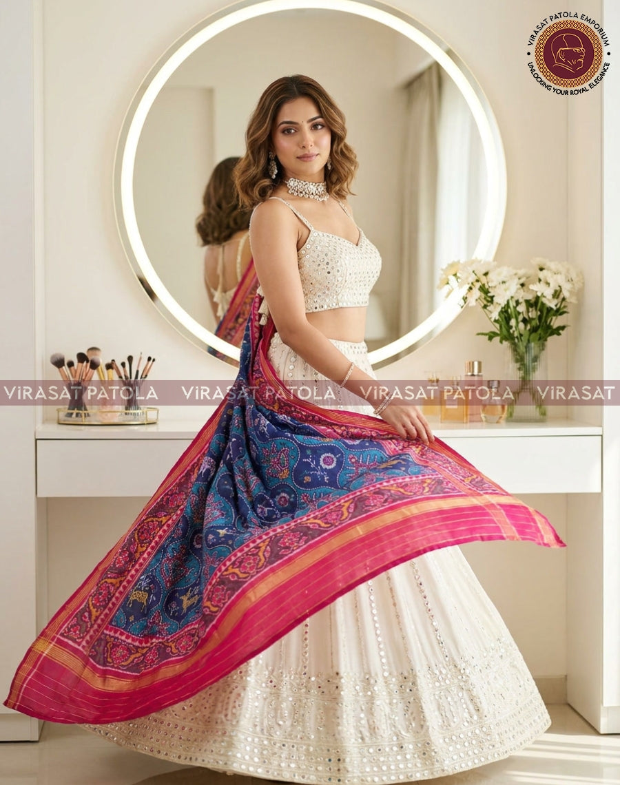 Blue patola dupatta with animal and floral motif, wide pink border and gold lines