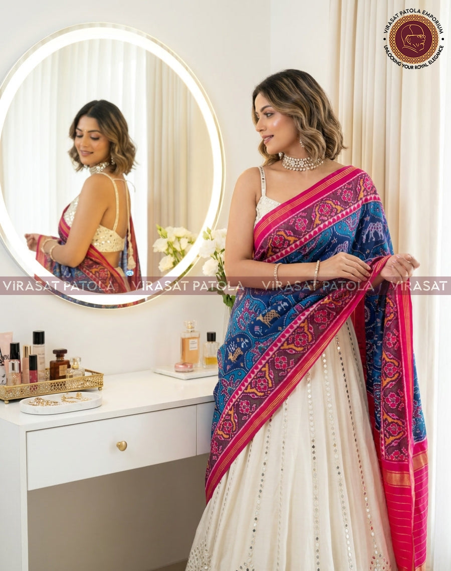 Blue patola dupatta with animal and floral motif, pink edge and blue patterned panel