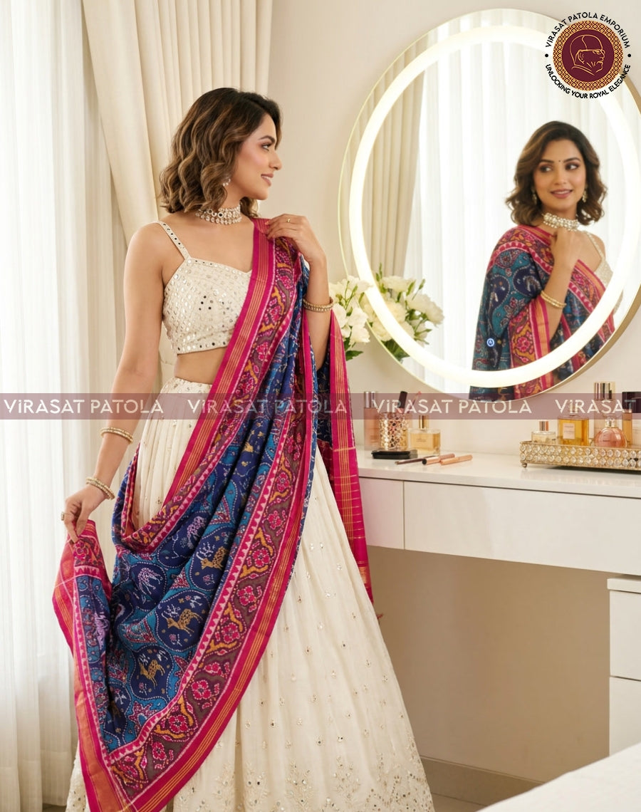 Blue patola dupatta with animal and floral motif, pink border and blue body