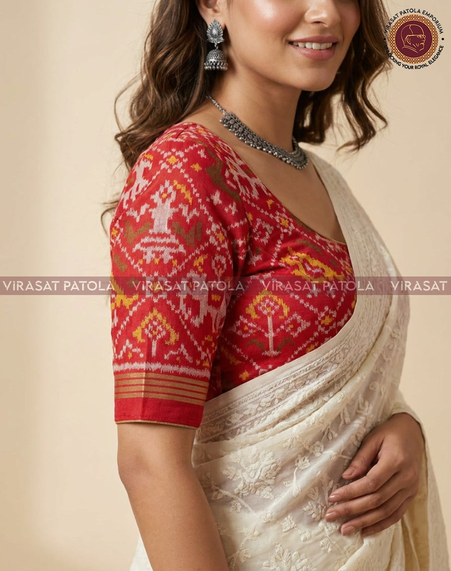 Red patola blouse with elbow sleeves and geometric motifs, round neckline