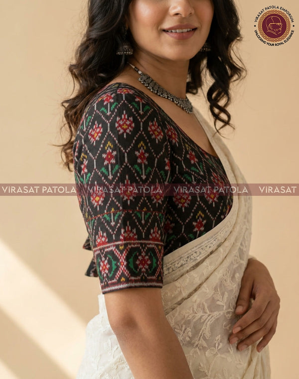 Traditional patola blouse piece in black with multicolor floral geometric print