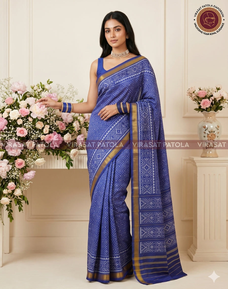 Blue bandhani traditional patola saree with gold border and geometric diamond motifs