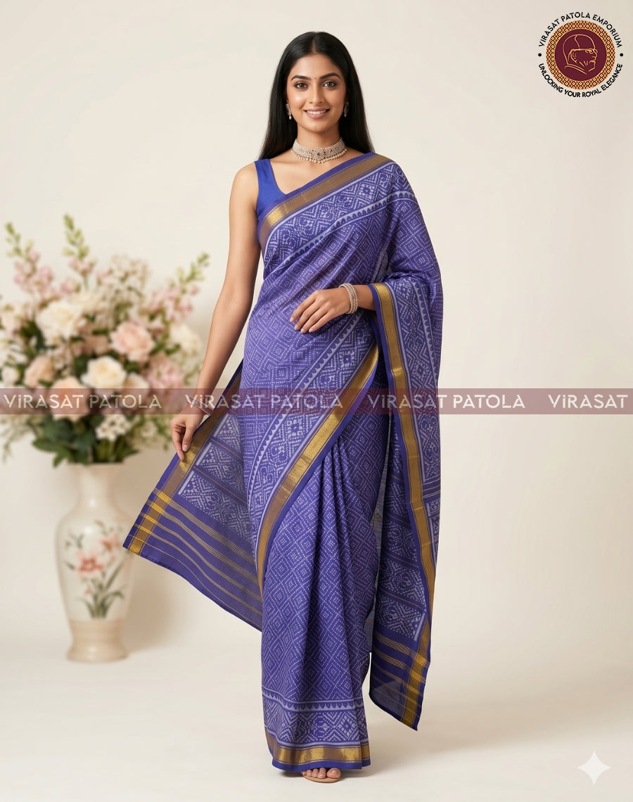 Blue saree with gold border, all-over geometric motifs, and pleated drape