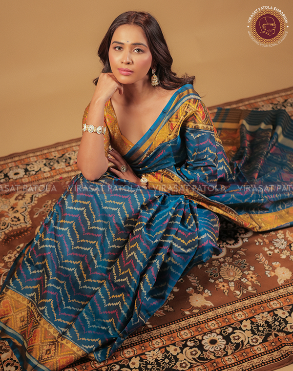 Blue Laheriya patola saree, zigzag motif and gold border, draped