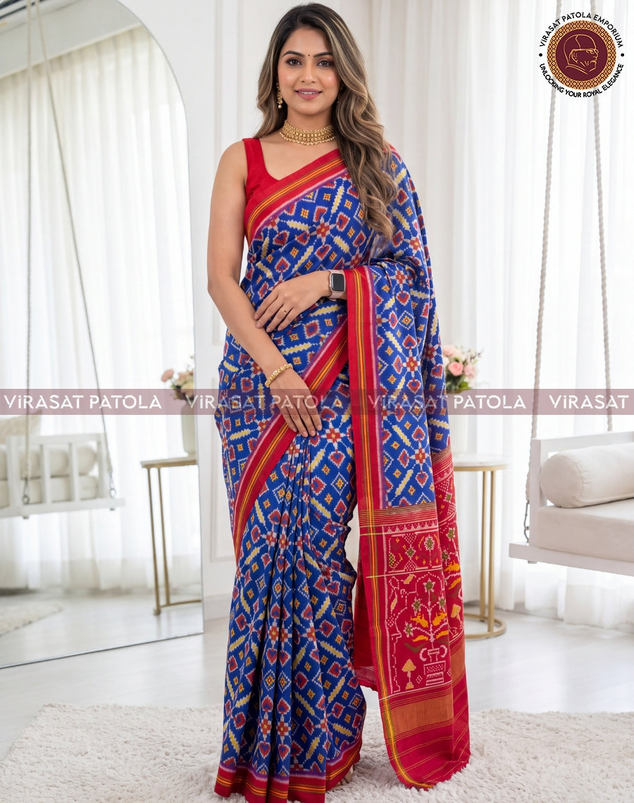 Blue and red patola saree with red-gold pallu panel and geometric motifs