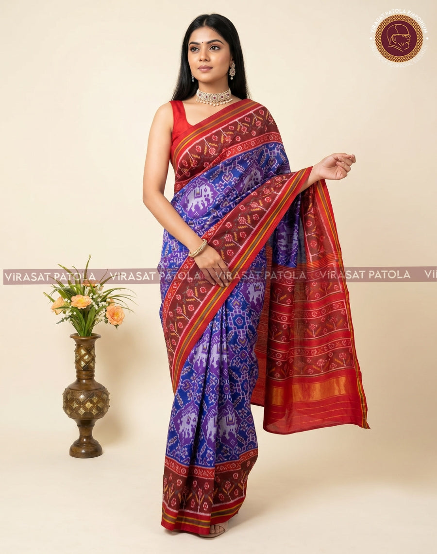 Traditional patola saree, blue body with geometric print and maroon pallu, gold border