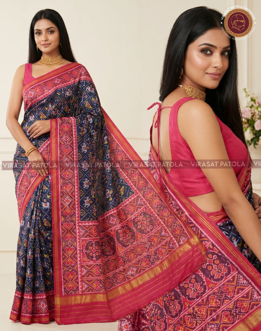 Close view of dark blue Patola saree pallu, red motifs and gold striped border