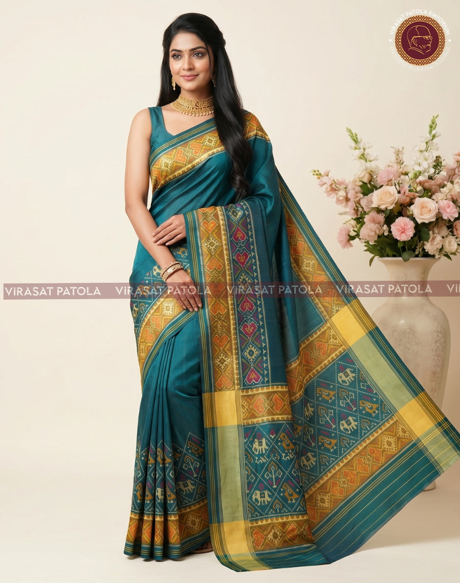 Dark green saree with wide gold-yellow border and multicolor patola motifs