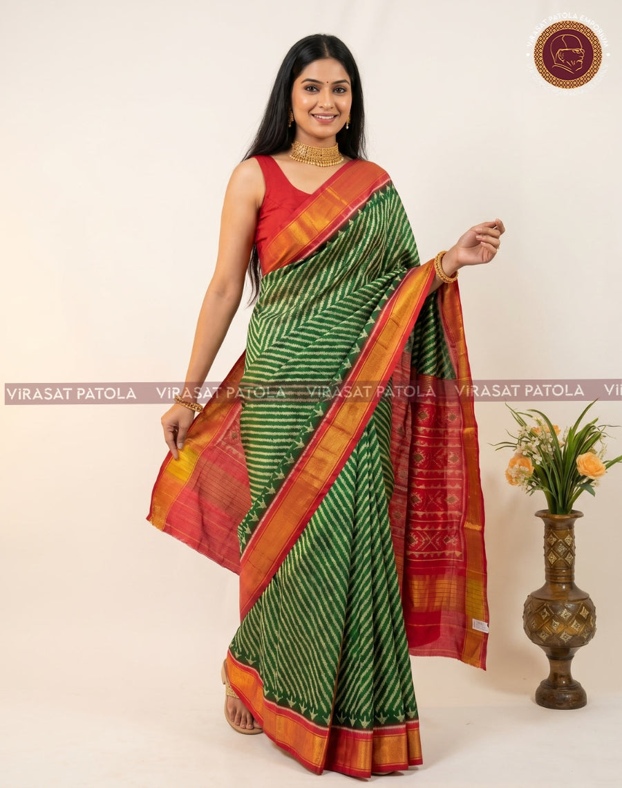 Green lahariya patola saree, red pallu with gold border and fine zigzag motifs