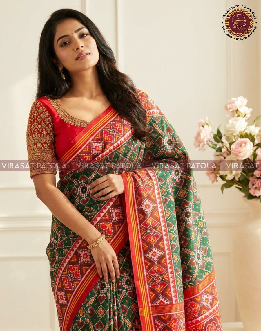 Green patterned saree with red and orange border, geometric motifs and gold trim