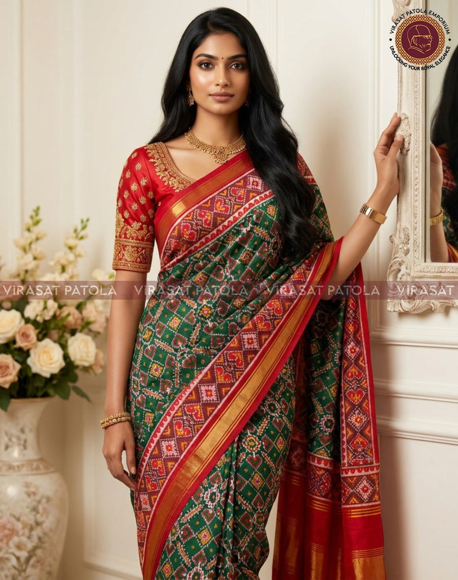 Green saree with red pallu panel, diagonal patterned stripes and gold-trimmed edge