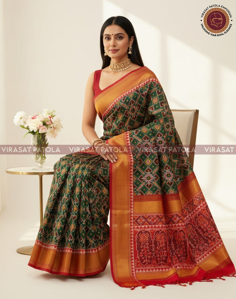 Green saree with wide red-orange border and gold zari, pleated fall and pallu