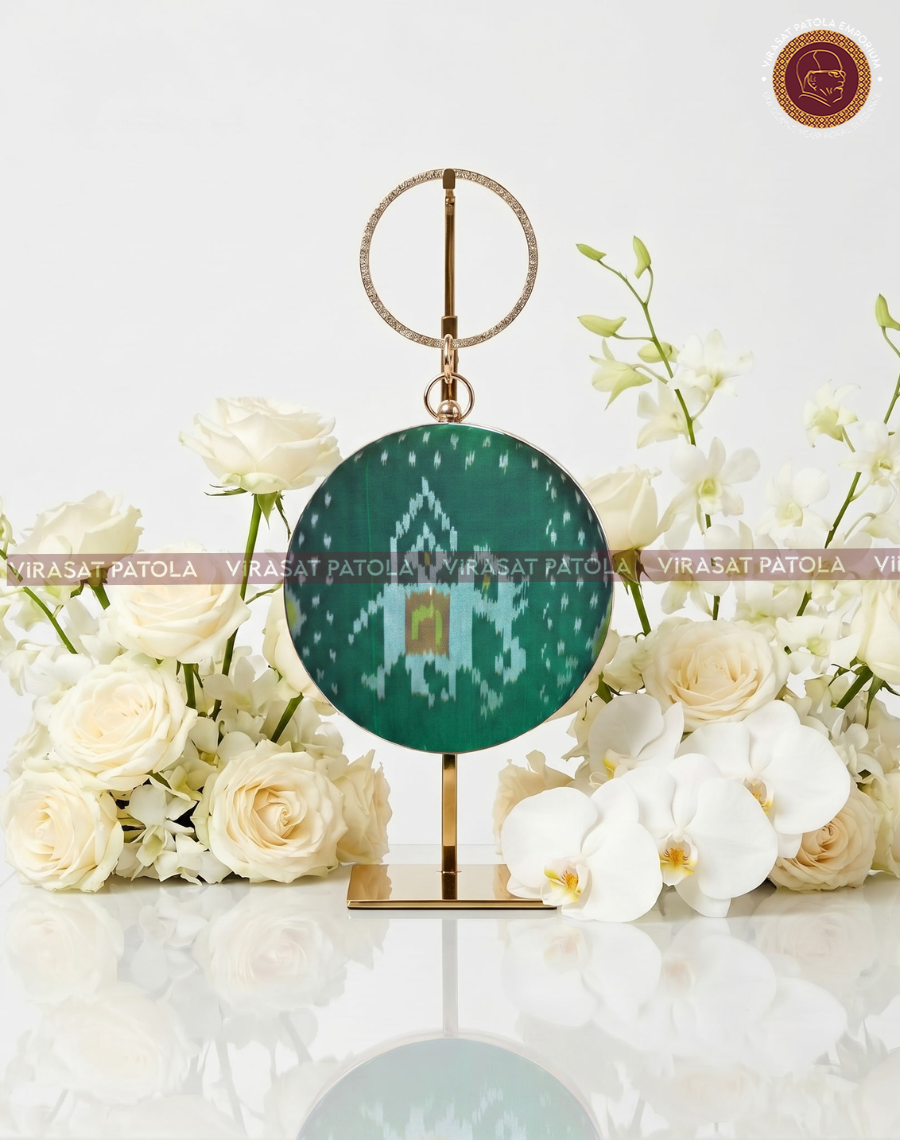 Green patola bandhani round clutch with gold ring handle