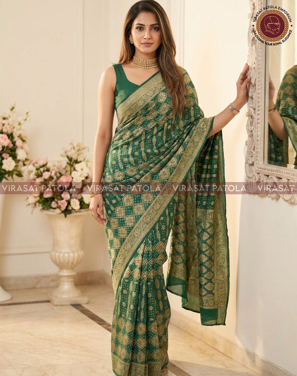 Green bandhani georgette saree with gold border, draped over shoulder