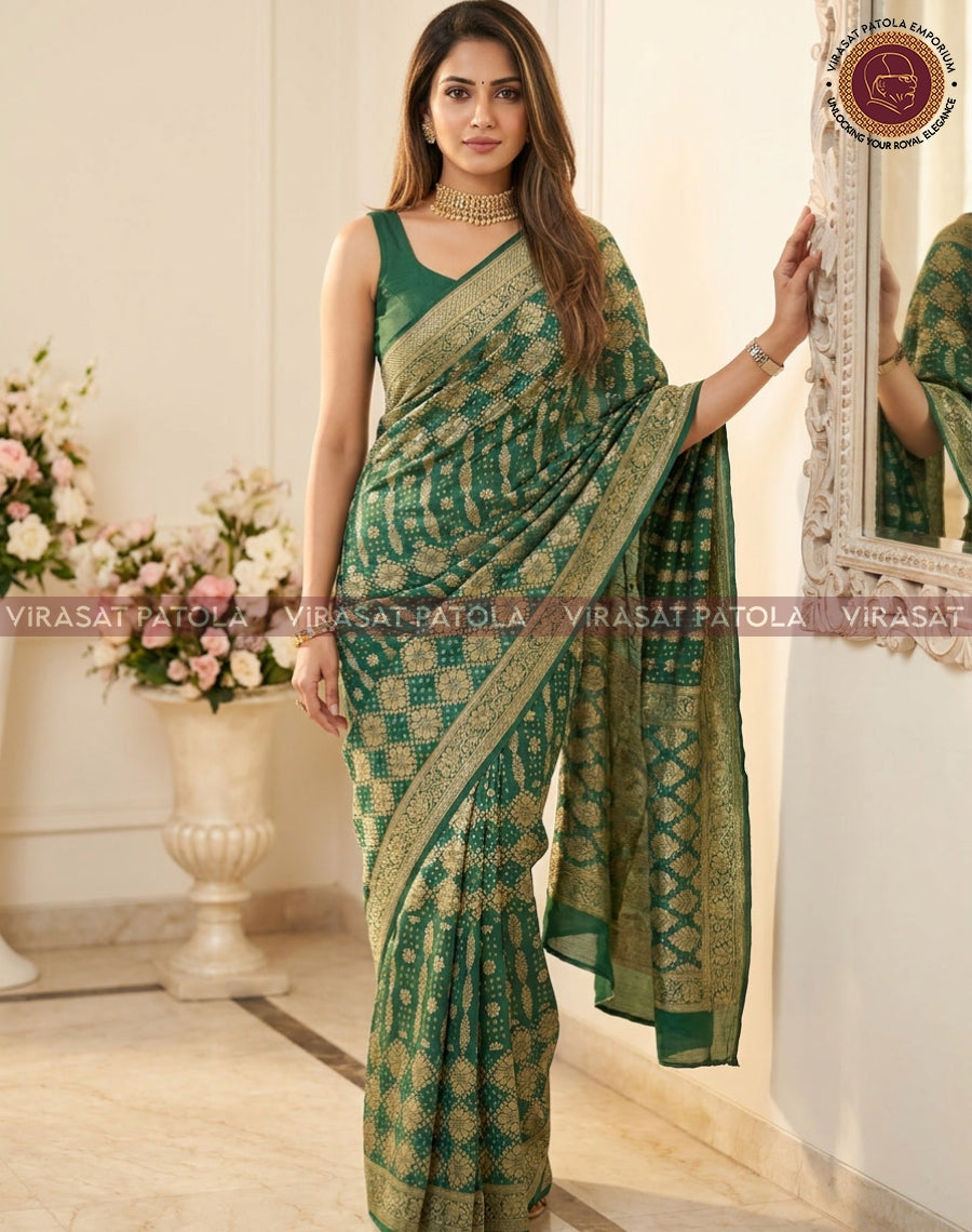 Green bandhani georgette saree with gold border, draped over shoulder