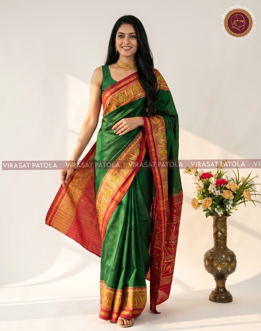Virasat Patola green patola saree, red-gold border and pallu on model.