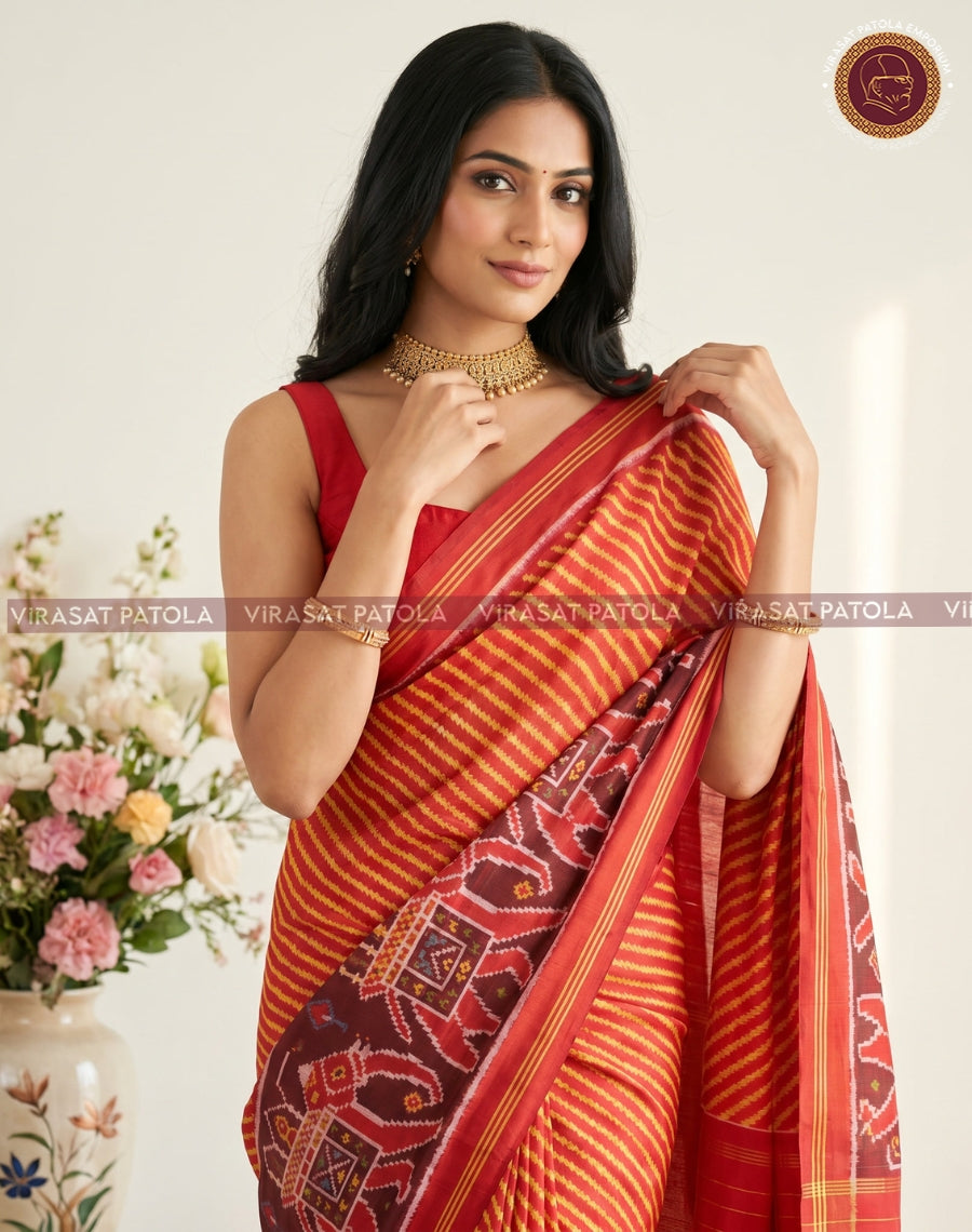 Traditional Leheriya Patola saree in rust-orange with maroon patterned border and pallu