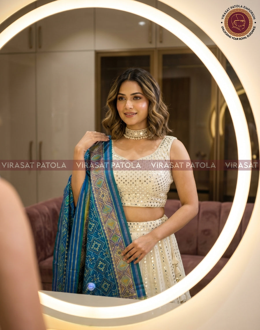 Pastel blue panchanda patola dupatta with detailed geometric weave and gold-edged border