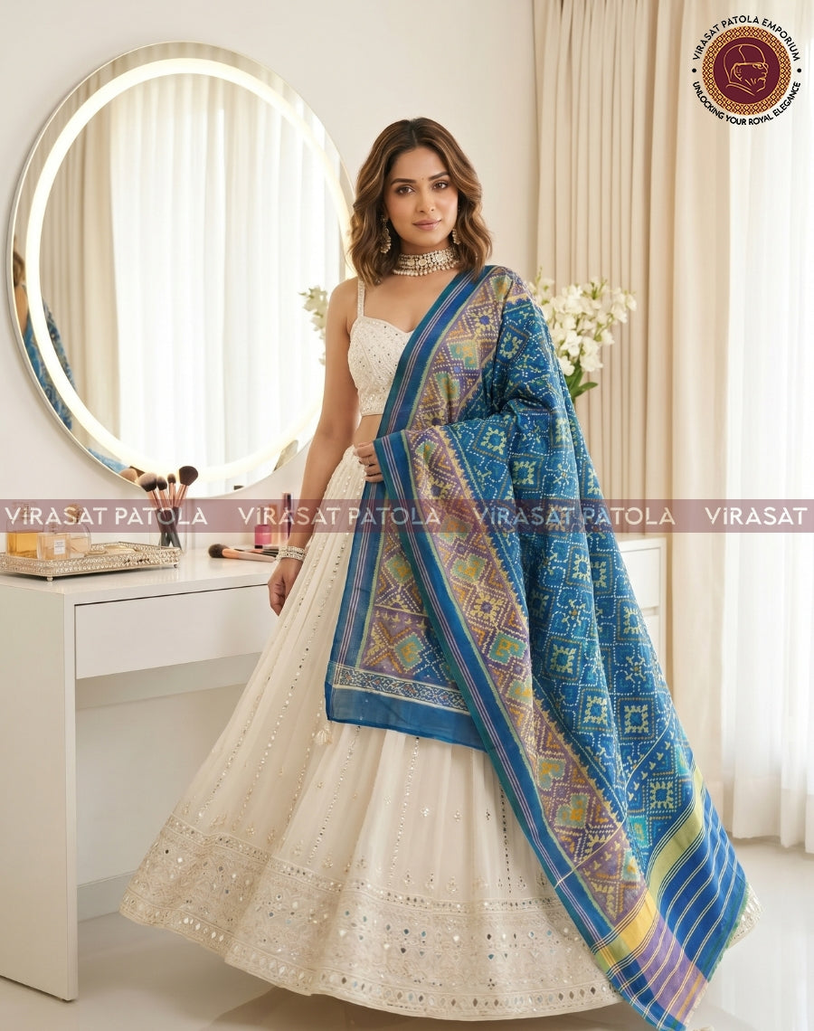 Pastel blue panchanda patola dupatta with patterned blue field and striped border