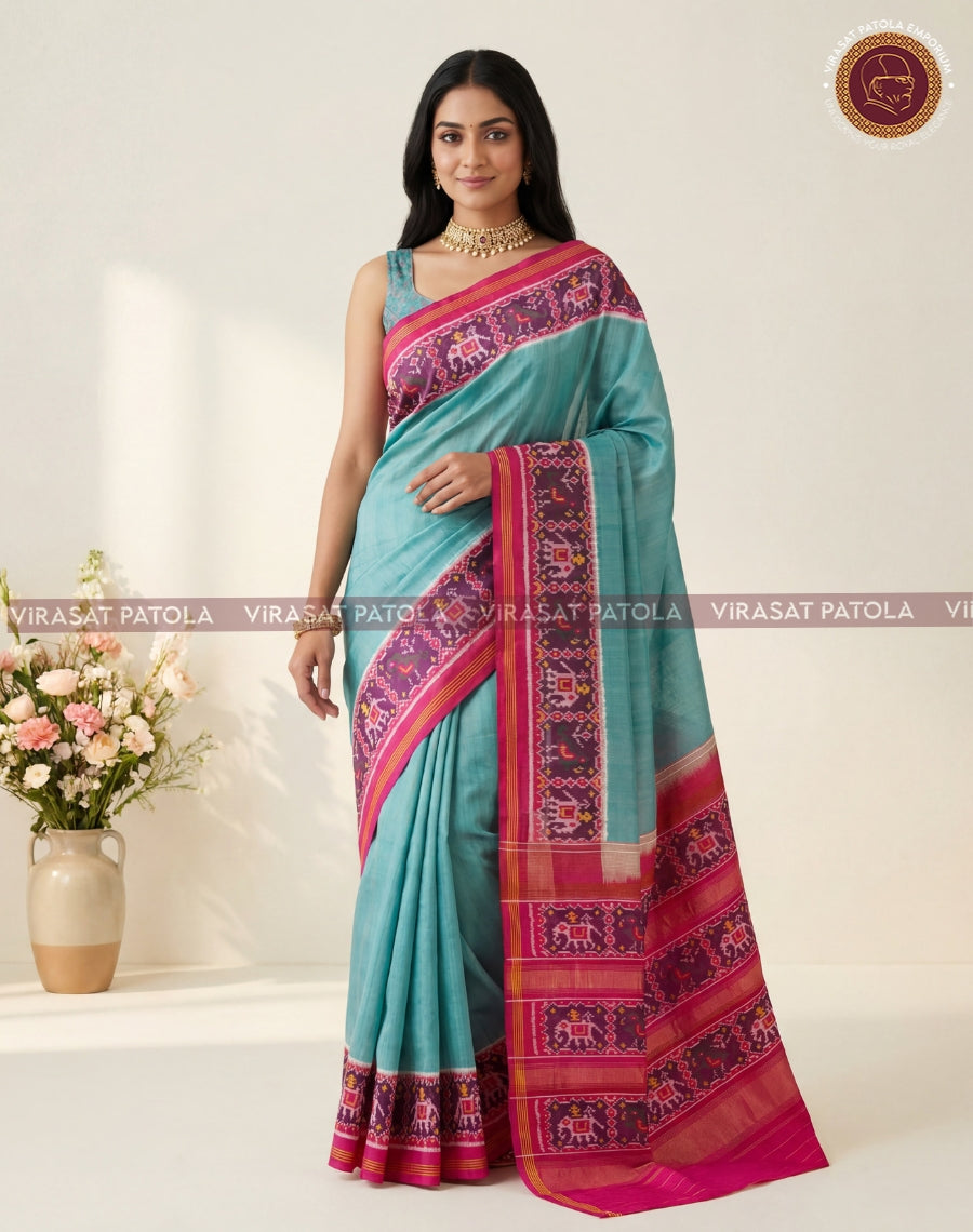 Teal patola saree with magenta patterned pallu and border, woven motif details