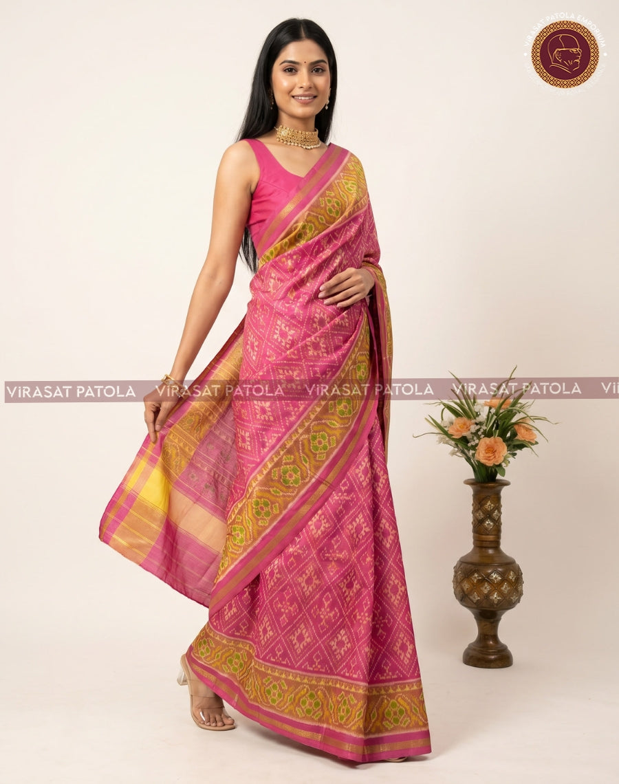 Pink traditional patola saree with golden motif patterns and contrast border drape