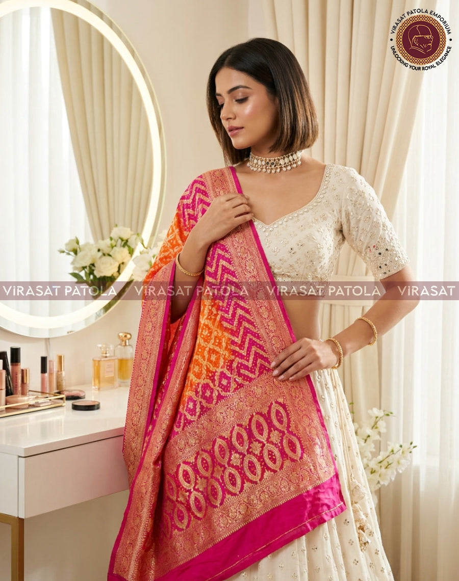 Magenta and orange bandhani dupatta with circular motif border, draped across chest