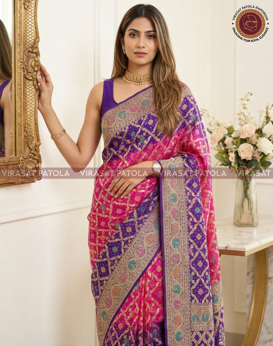 Bandhani saree with pink field and purple pallu, decorated with teal and gold motifs