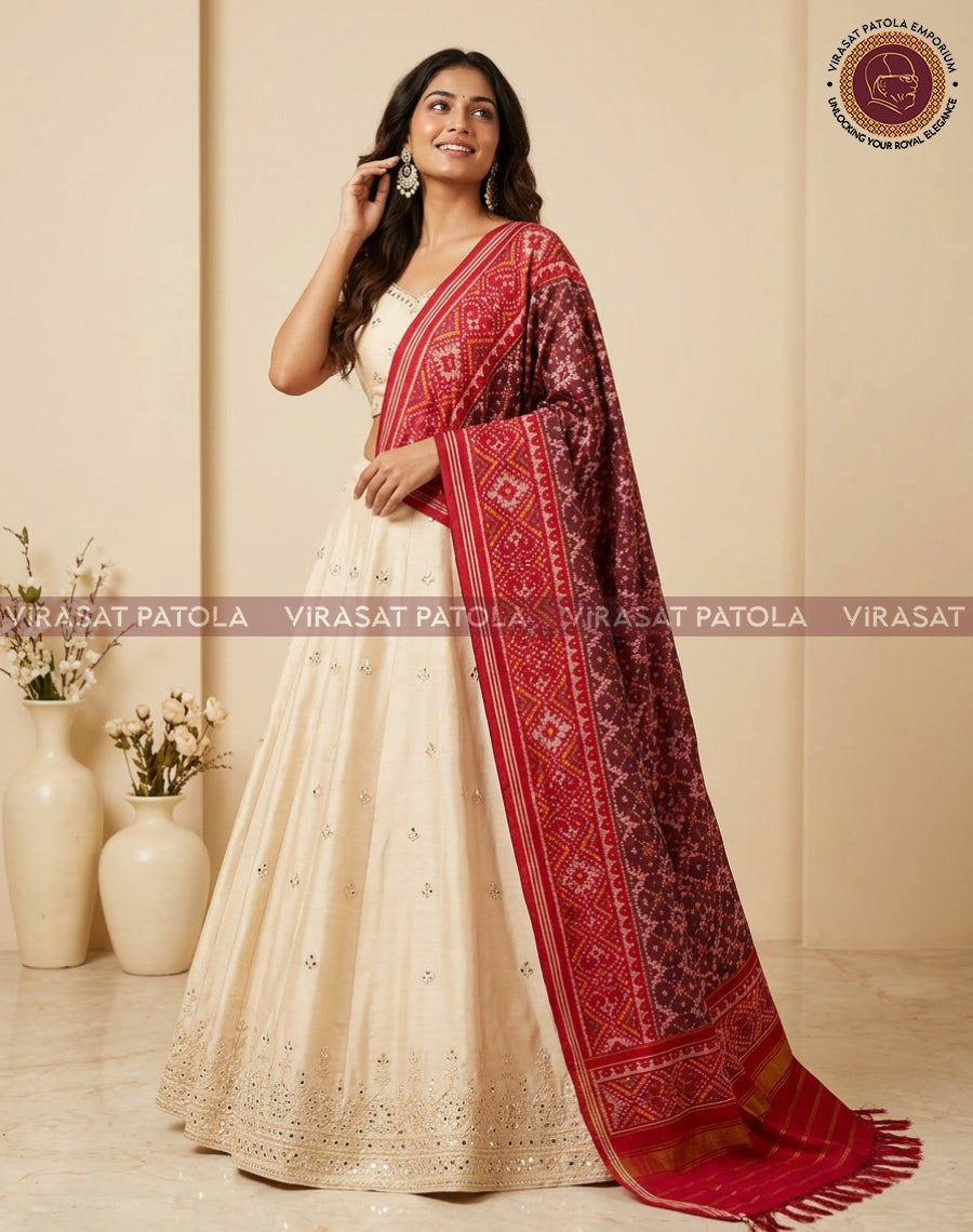 Maroon red patola dupatta with traditional lattice motifs and gold border, long fringes