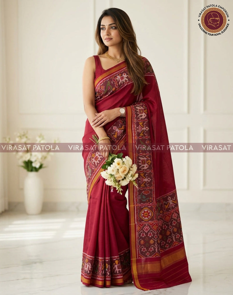 Maroon saree with contrast woven motifs, gold border and patterned pallu end