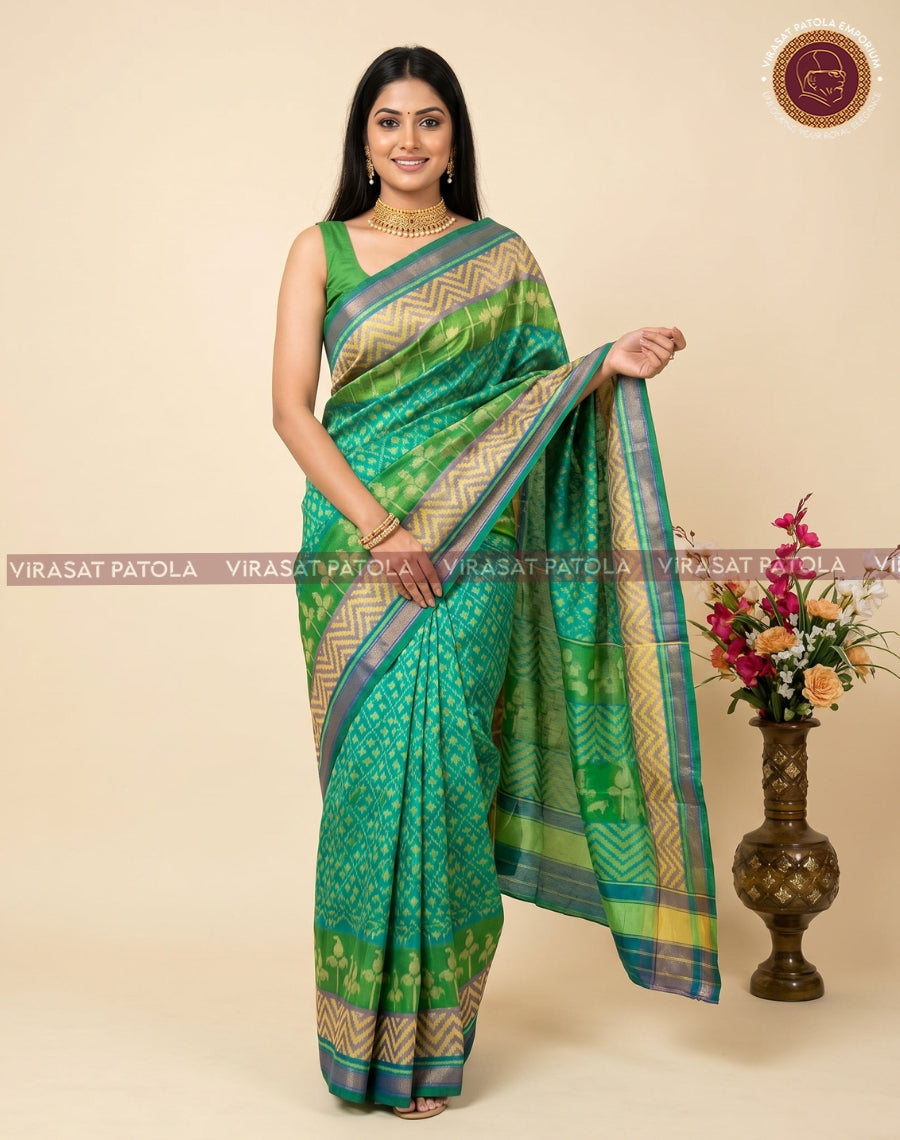 Fancy patola saree in green with woven temple motifs and blue-striped border