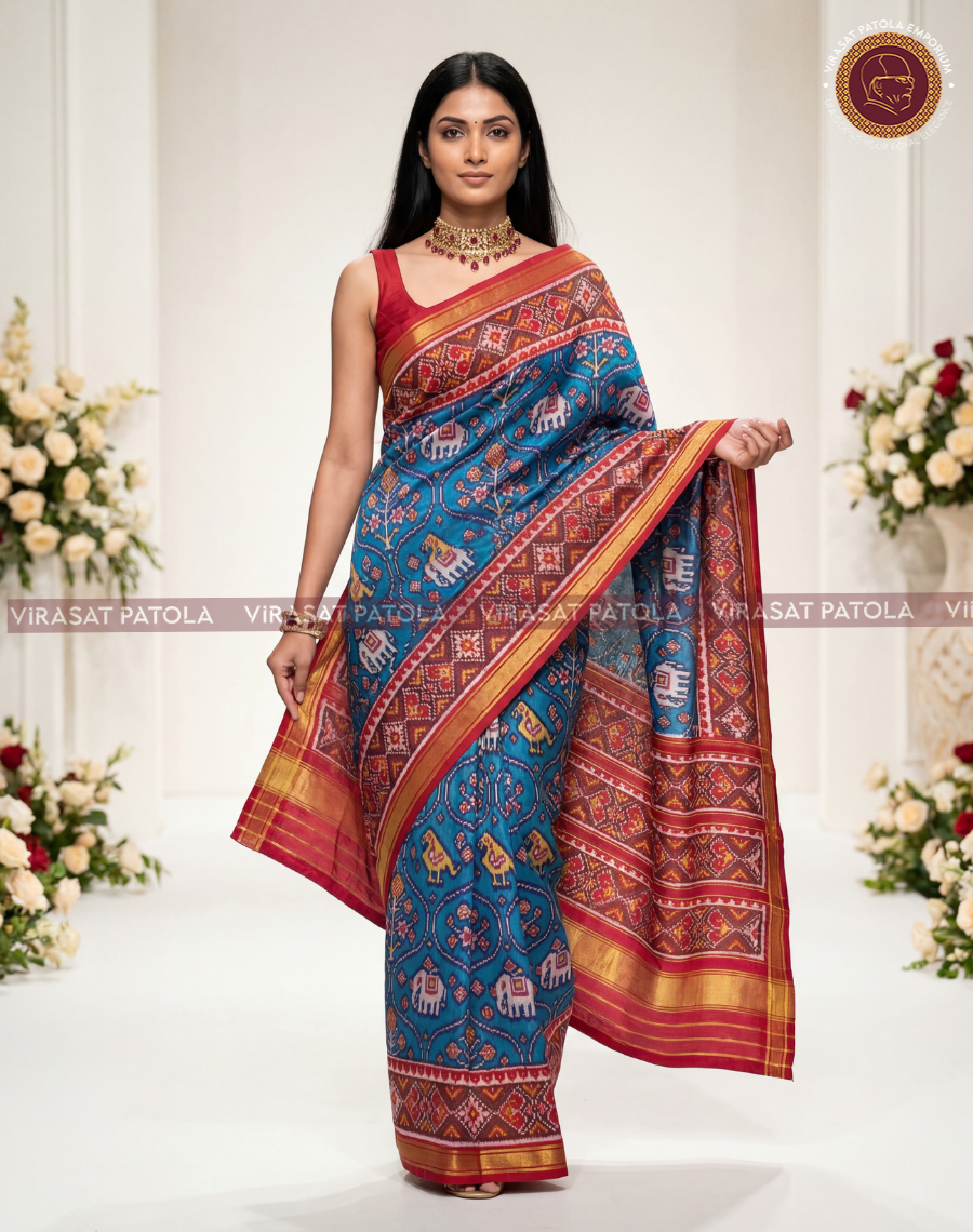 Blue saree with red-and-gold border and central Nari Kunjar-style motifs