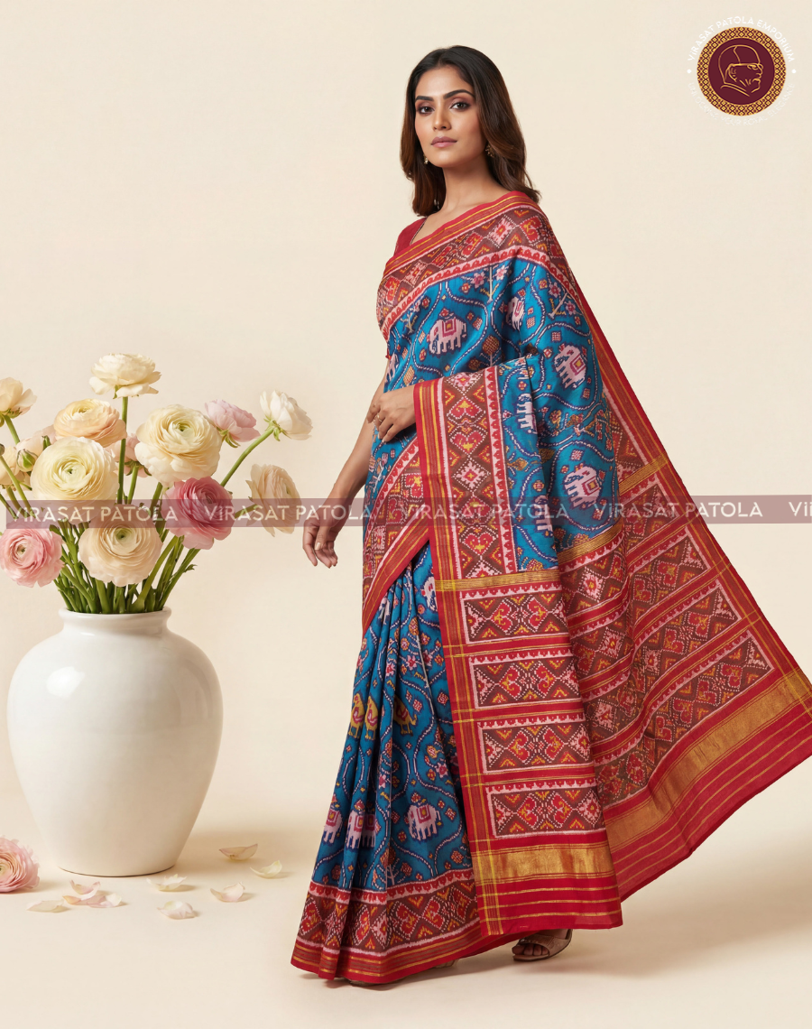 Blue patola saree with red border, geometric motifs and gold-toned pallu