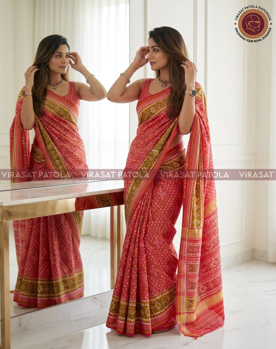 Pink sari with small dot pattern and wide gold-green border, pleated drape