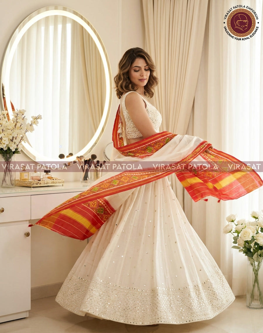Patola duppatta in orange and white, spread out with striped border