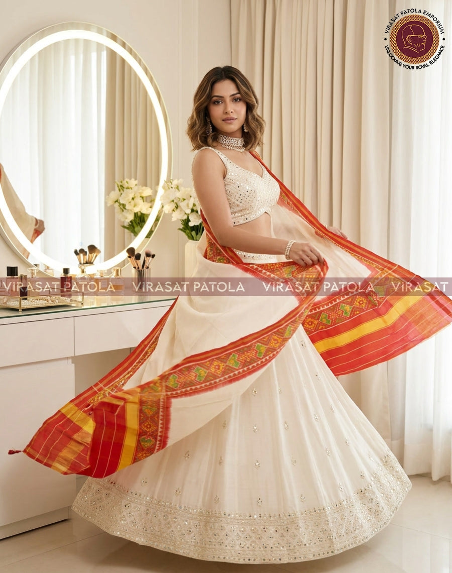 Patola duppatta in orange and white with wide border and woven motifs