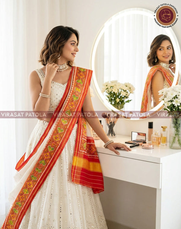 Patola duppatta in white and orange with ornate geometric border