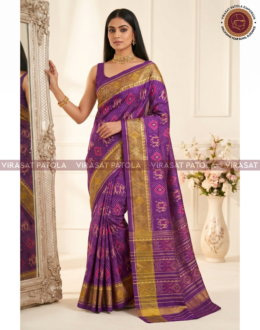 Traditional patola saree: wine-purple with gold border, diamond motifs and pallu