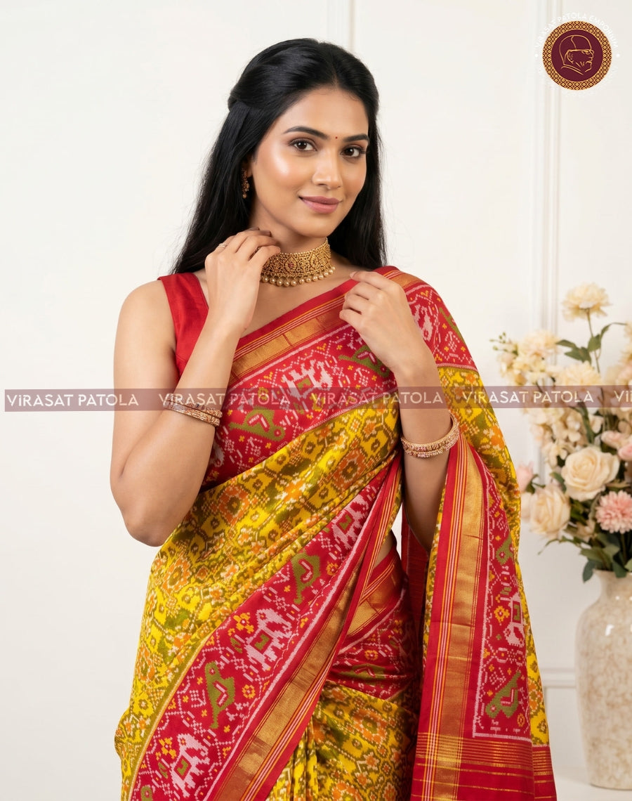 Yellow and red patola saree, pallu draped with woven geometric motifs and border