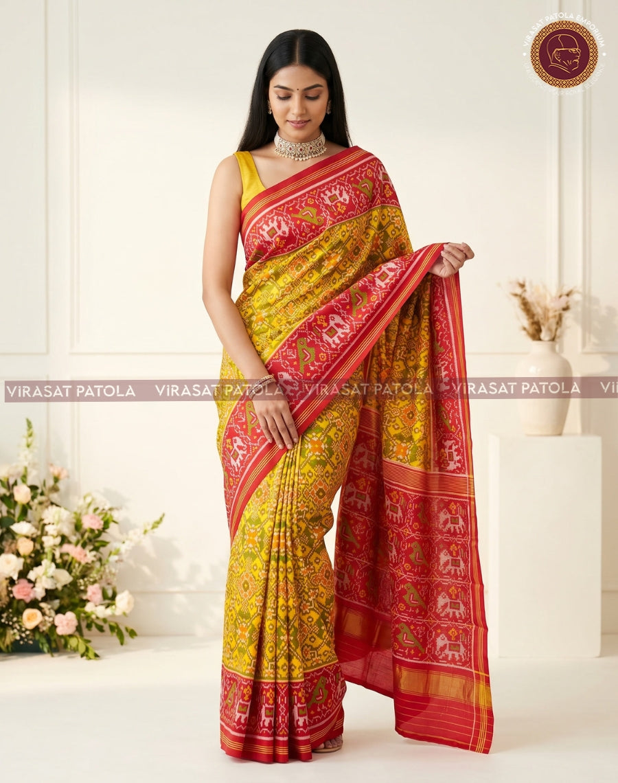 Yellow and red patola saree with ornate woven motifs and wide red border hem