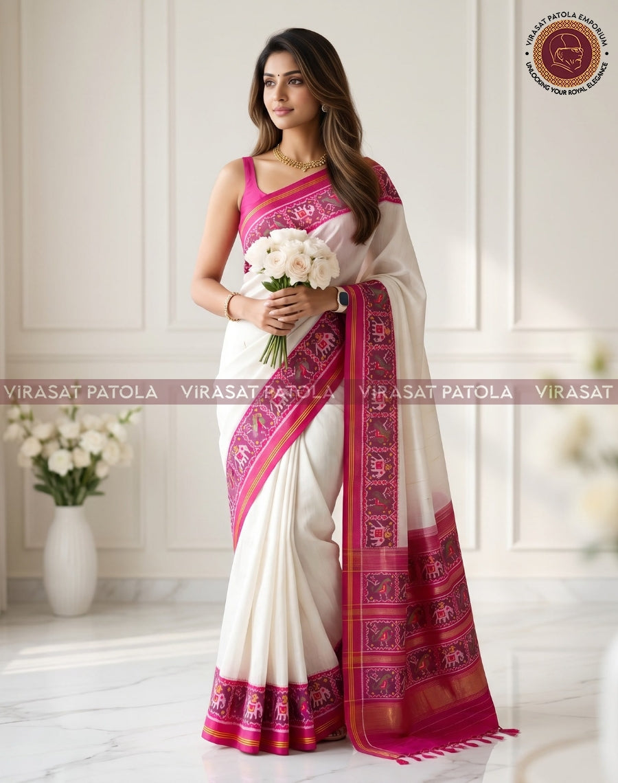 White patola saree with pink-magenta border and traditional motif pallu