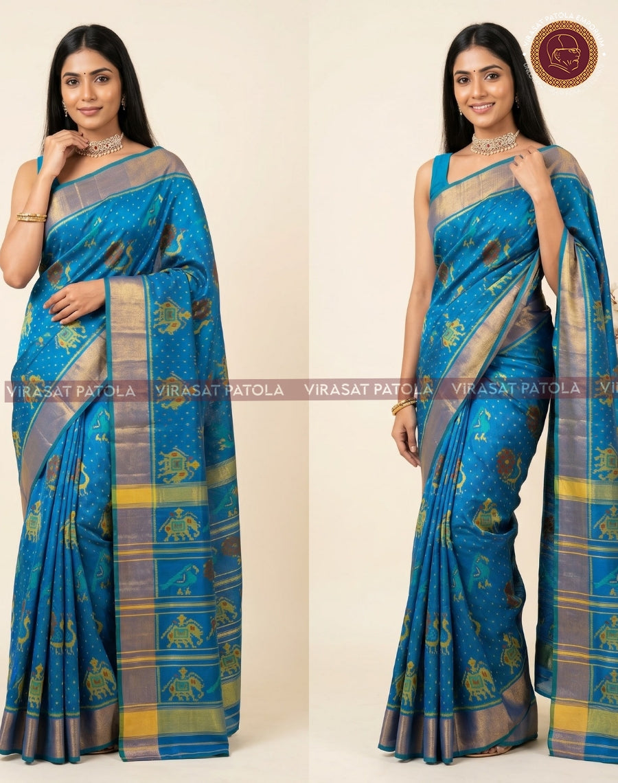 Charcoal blue Narikunjar traditional patola saree, wide zari border and pallu detail
