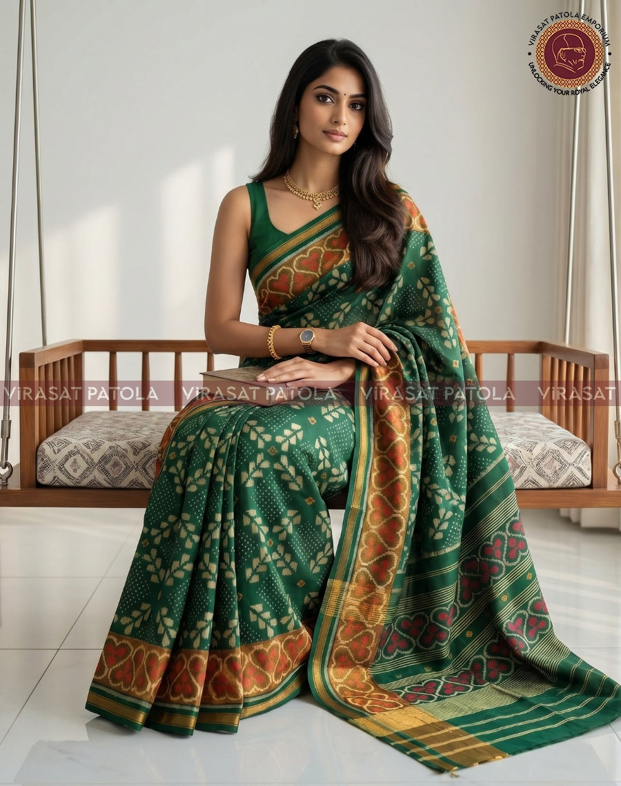 Green patola saree draped with red and gold border stripe, patterned body